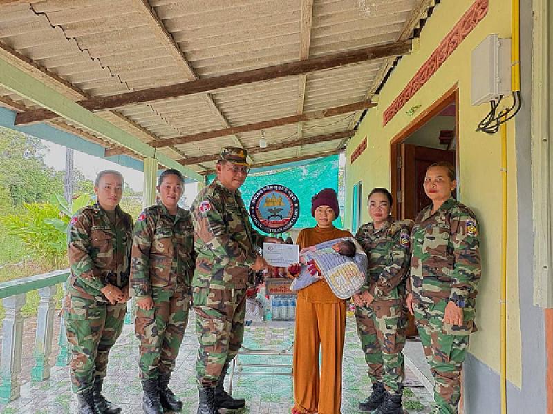 Koh Kong Provincial Military Police brings a gift from the King to a sergeant after maternity leave